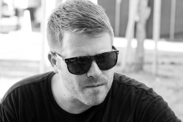 Headshot of El-P wearing sunglasses